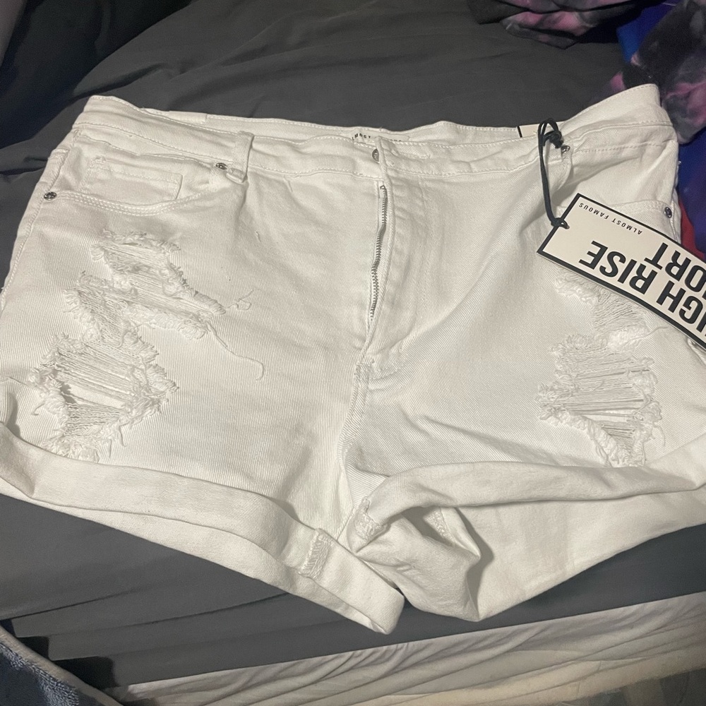 White denim shorts ripped